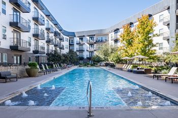 Sparkling pool with bubblers at abstract at design district in dallas tx, 75207